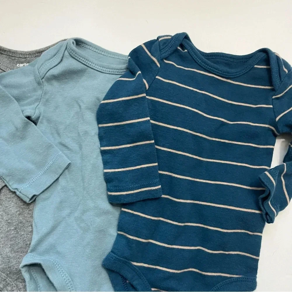 Carters • 4 Pack Baby Onesies Size 3 Months